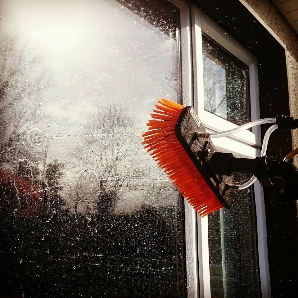 best window cleaner Meath in action cleaning a large building