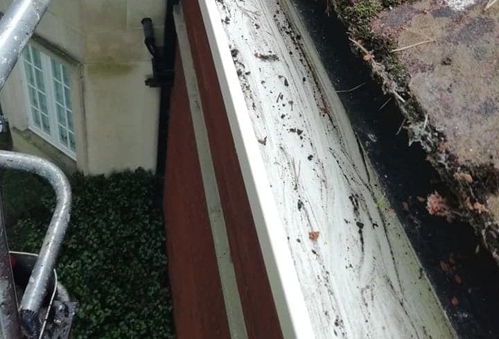 Photos of a gutter with all debris removed and cleaned.