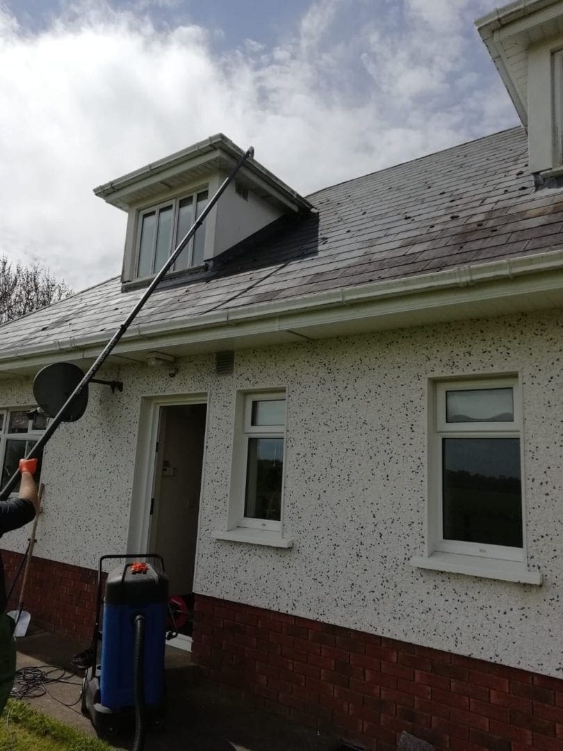 Cleaning Gutters using long reach poles