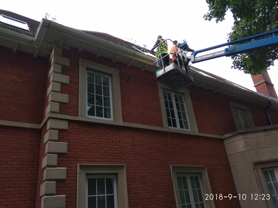 Cleaning difficult windows using a cherry picker and our long reach brooms Meath professional cleaners window cleaning
