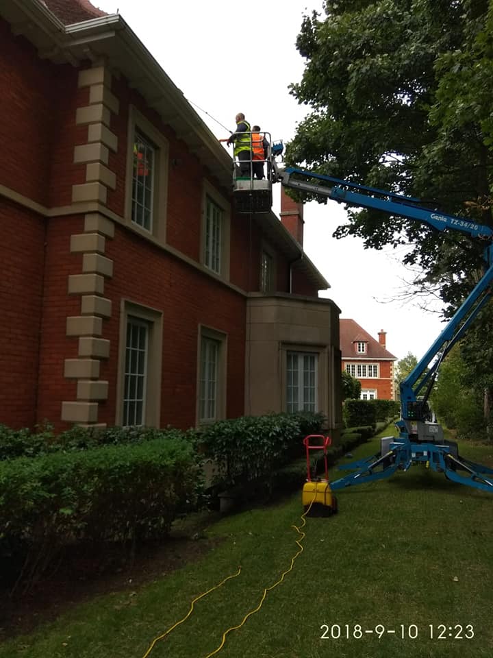 Cleaning difficult windows using a cherry picker and our long reach brooms window cleaning