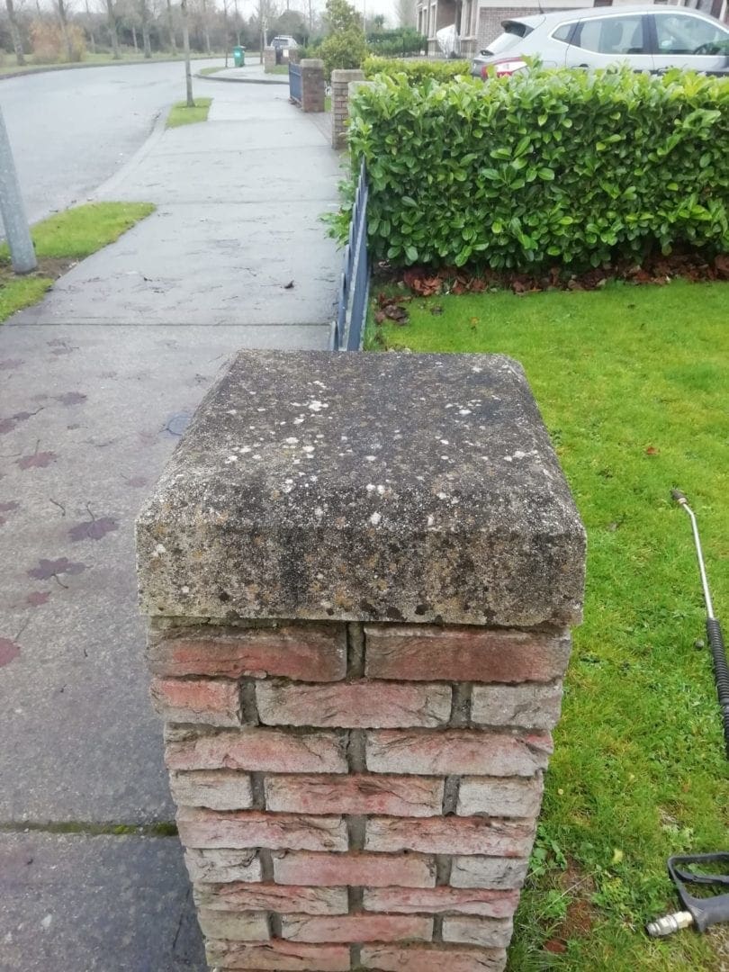 Gatepost dirty with moss and black algae - before cleaning