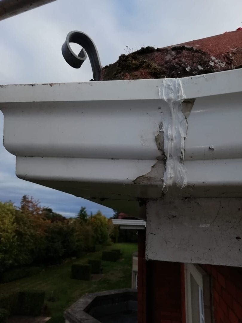 Gutter fixed on a roof and cleaned