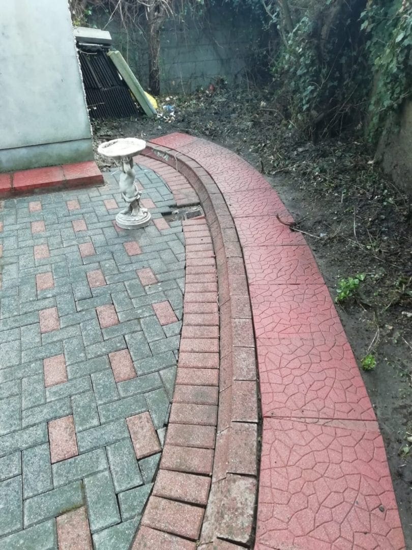 Kerb after cleaning on a driveway patio stones